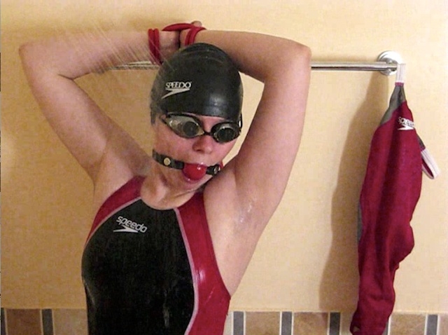Gagged and bounded in black-red LZR swimsuit